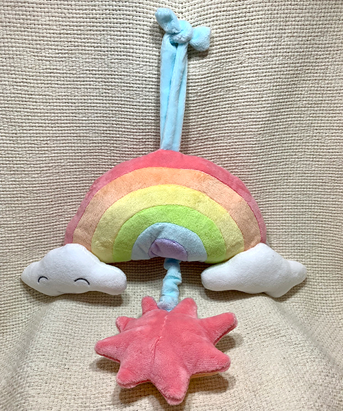 Musical pulldown rainbow crib toy
